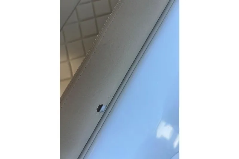 Slide: The Image of Close-up of a damaged seat on a 2017 Chris-Craft Calypso 26 boat. - 19