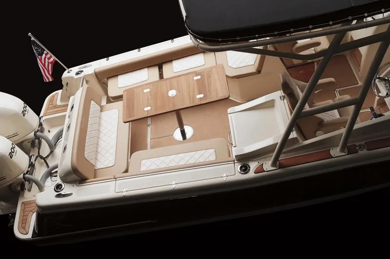 Slide: The Image of Manufacturer Provided Image: 2017 Chris-Craft Calypso 26 boat interior with seating and table. - 24
