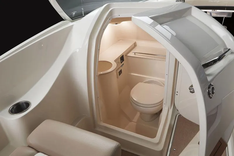 Slide: The Image of Manufacturer Provided Image: 2017 Chris-Craft Calypso 26 boat interior with a compact bathroom. - 25