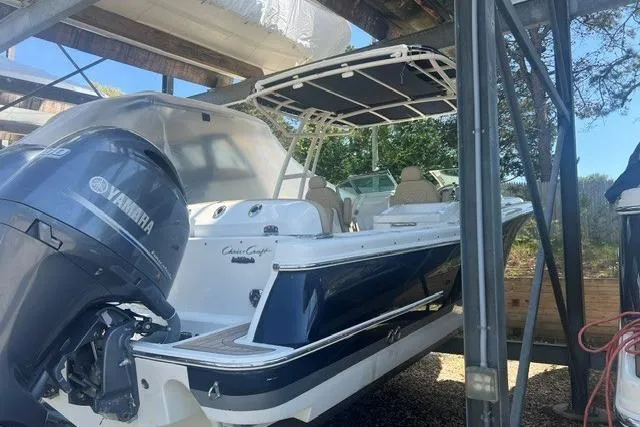 Slide: The Image of 2017 Chris-Craft Calypso 26 boat with Yamaha engine in storage. - 9