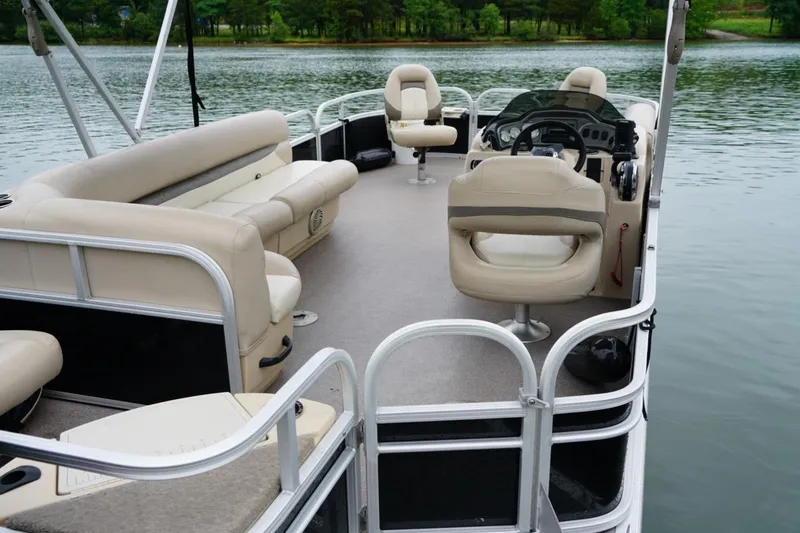 Slide: The Image of 2016 Sun Tracker Fishin' Barge 20 DLX pontoon boat on a serene lake. - 9