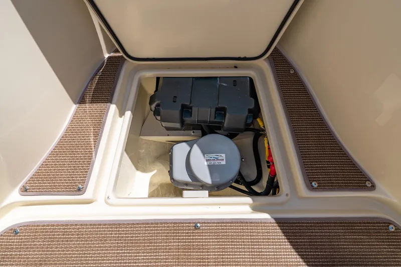 Slide: The Image of 2024 Chris-Craft Catalina 30 storage compartment with equipment and wiring. - 12