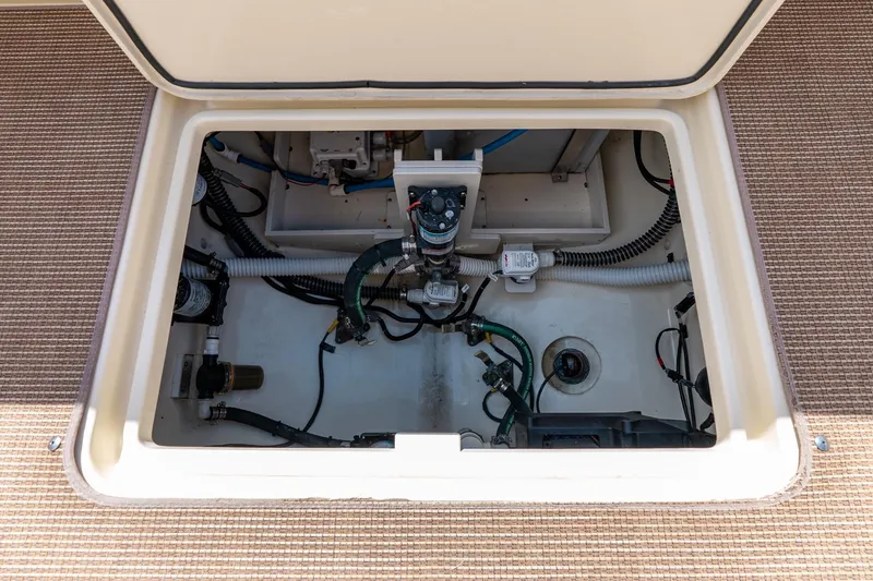 Slide: The Image of 2024 Chris-Craft Catalina 30 engine compartment showcasing detailed wiring and components. - 35