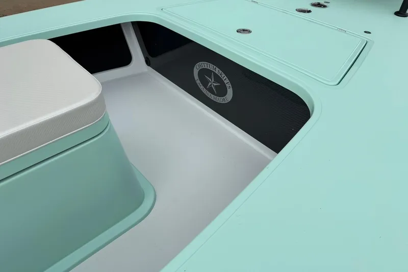 Slide: The Image of 2026 Chittum Skiffs 18 Laguna Madre Carbon interior with seating and storage. - 13