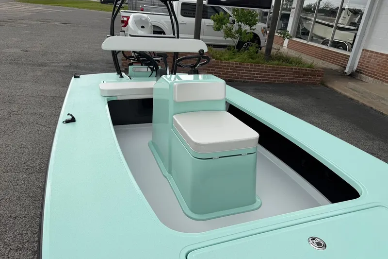 Slide: The Image of 2026 Chittum Skiffs 18 Laguna Madre Carbon boat with mint green deck and seating. - 14