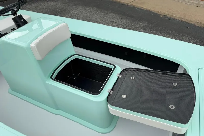 Slide: The Image of 2026 Chittum Skiffs 18 Laguna Madre Carbon boat with open storage compartment. - 15
