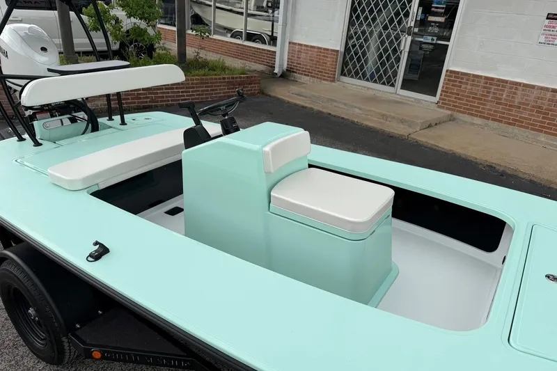 Slide: The Image of 2026 Chittum Skiffs 18 Laguna Madre Carbon boat with mint green interior and seating. - 16