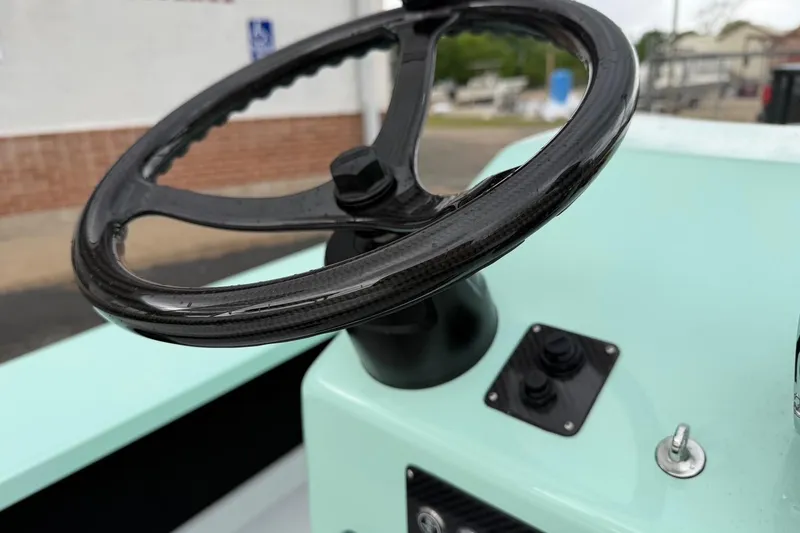 Slide: The Image of Steering wheel of 2026 Chittum Skiffs 18 Laguna Madre Carbon boat. - 18