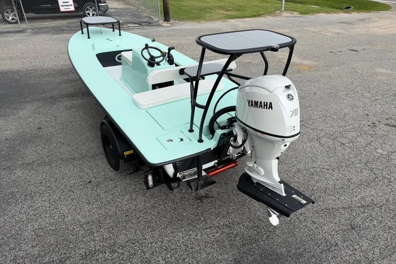 Slide: The Image of 2026 Chittum Skiffs 18 Laguna Madre Carbon with Yamaha 70 outboard motor on trailer. - 3