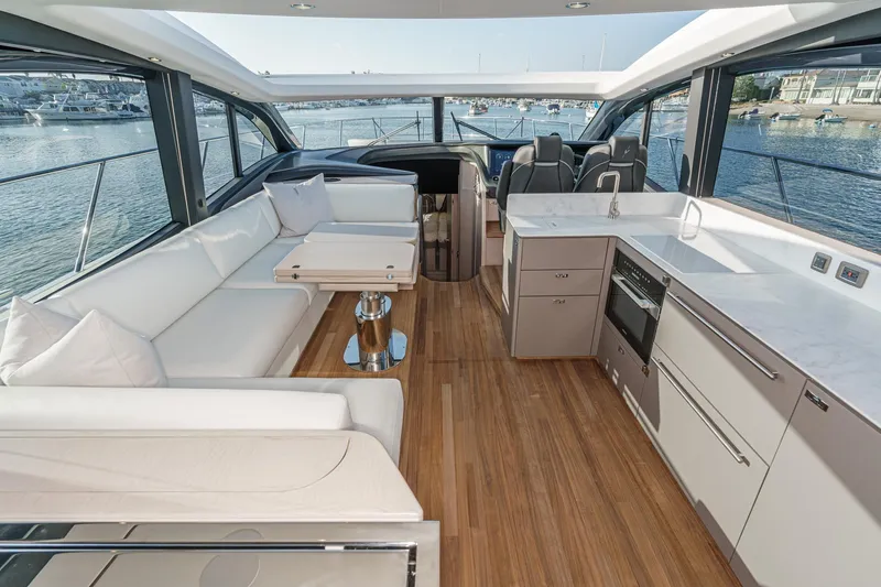 Slide: The Image of Luxurious interior of 2026 Princess V55 yacht with modern kitchen and seating area. - 30