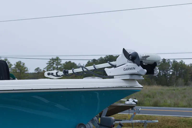 Slide: The Image of 2025 Key West 239 FS boat with Garmin trolling motor on trailer. - 2