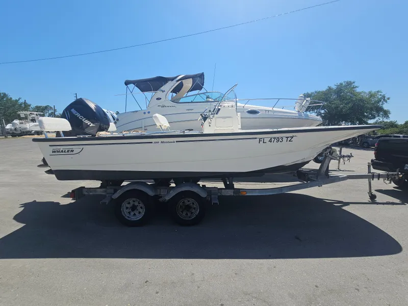 The Image of 2015 Boston Whaler 190 Montauk boat on trailer outdoors. - 0