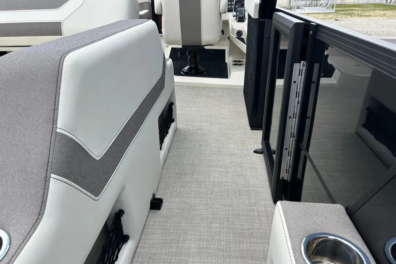 Slide: The Image of Interior of 2026 Alera M23L boat with modern seating and cup holder. - 13
