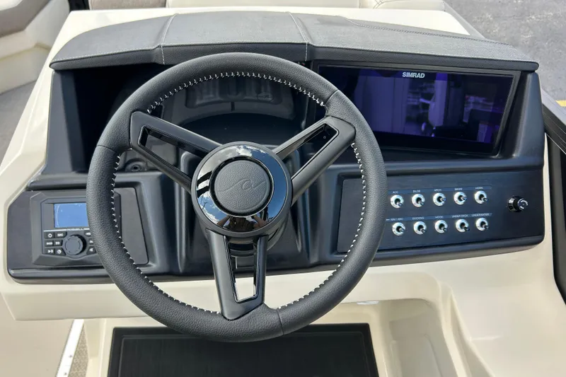 Slide: The Image of Steering wheel and dashboard of 2026 Alera M23L boat with control panel and display. - 20