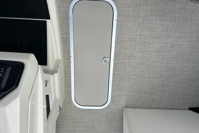 Slide: The Image of Interior view of Alera M23L 2026 boat with sleek design and storage compartment. - 23