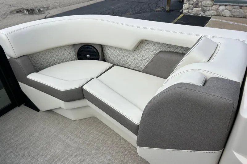 Slide: The Image of Luxurious seating in the 2026 Alera M23L boat, featuring elegant white and gray upholstery. - 30
