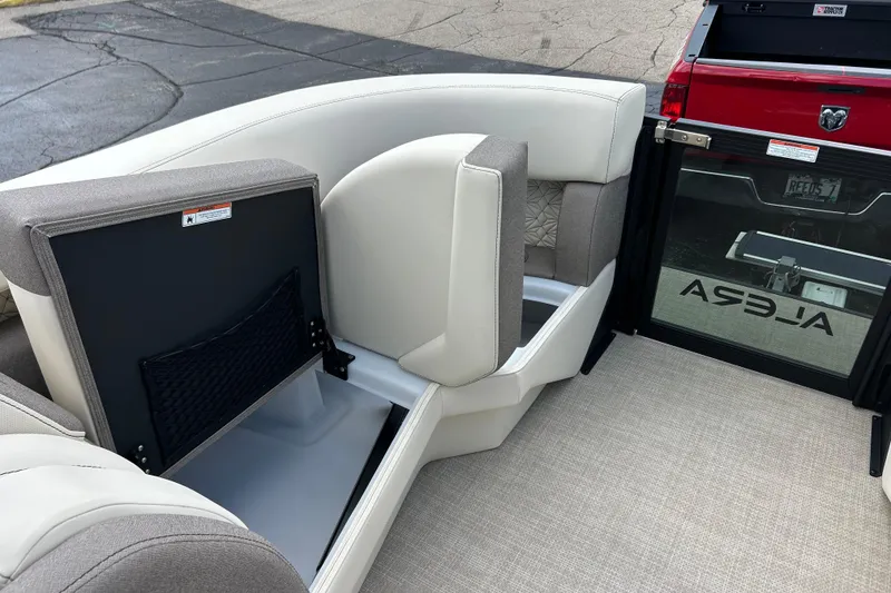 Slide: The Image of Interior of 2026 Alera M23L boat with open storage compartment and seating. - 35