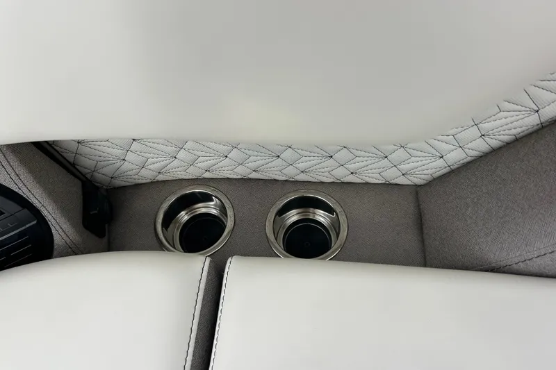 Slide: The Image of Luxury interior of 2026 Alera M23L with quilted upholstery and dual cup holders. - 36