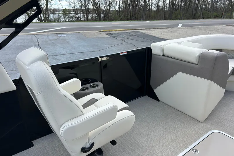 Slide: The Image of Interior of 2026 Alera M23L boat with white seating and cup holders. - 42