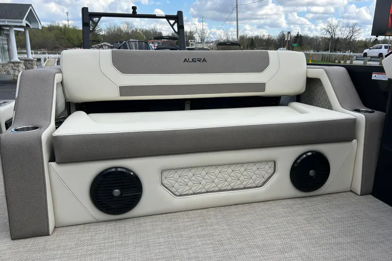 Slide: The Image of Alera M23L 2026 boat interior with cushioned seating and built-in speakers. - 44