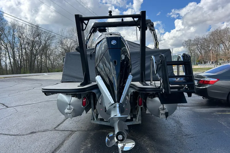 Slide: The Image of Alera M23L 2026 boat with powerful outboard motor, parked on a paved surface. - 46