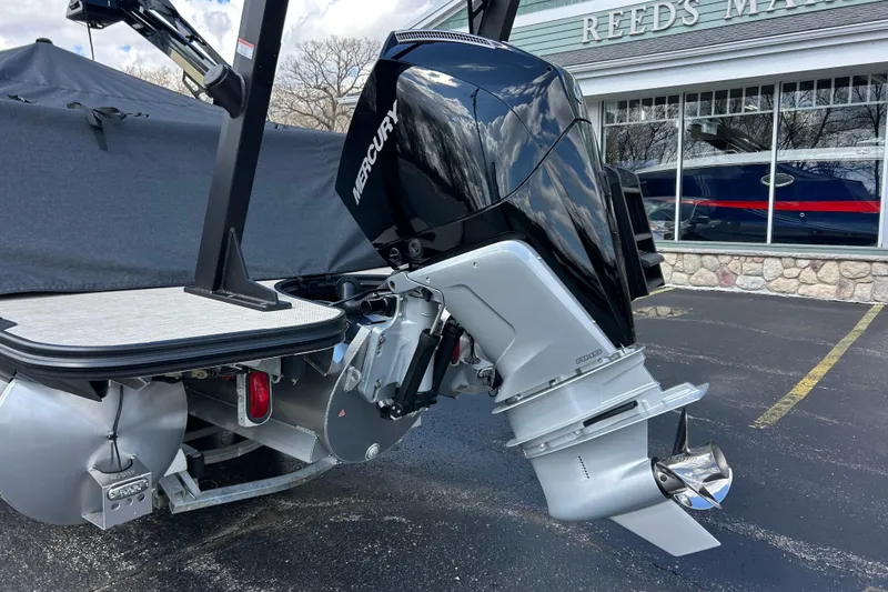 Slide: The Image of Outboard motor on Alera M23L boat, 2026 model, parked at marina. - 47