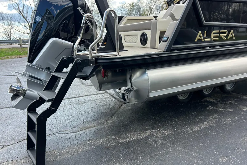 Slide: The Image of 2026 Alera M23L pontoon boat with Mercury outboard motor and sleek design. - 9