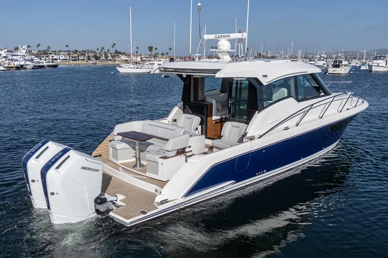 Slide: The Image of 2026 Tiara Yachts 43LE luxury boat on water, featuring sleek design and powerful Mercury engines. - 12