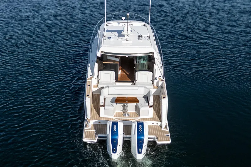 Slide: The Image of 2026 Tiara Yachts 43LE cruising on open water, showcasing luxury design and powerful engines. - 14