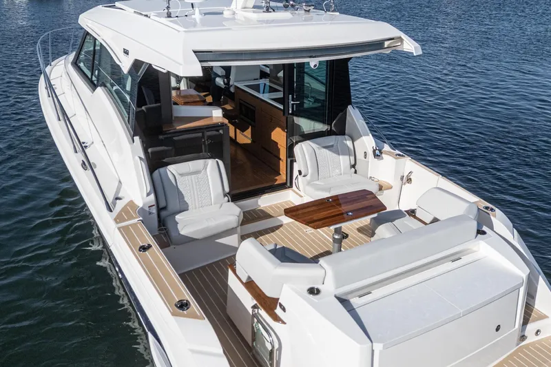 Slide: The Image of 2026 Tiara Yachts 43LE luxury boat with spacious deck and elegant seating. - 16