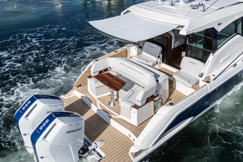 Slide: The Image of 2026 Tiara Yachts 43LE luxury boat with spacious deck and twin Mercury engines. - 17