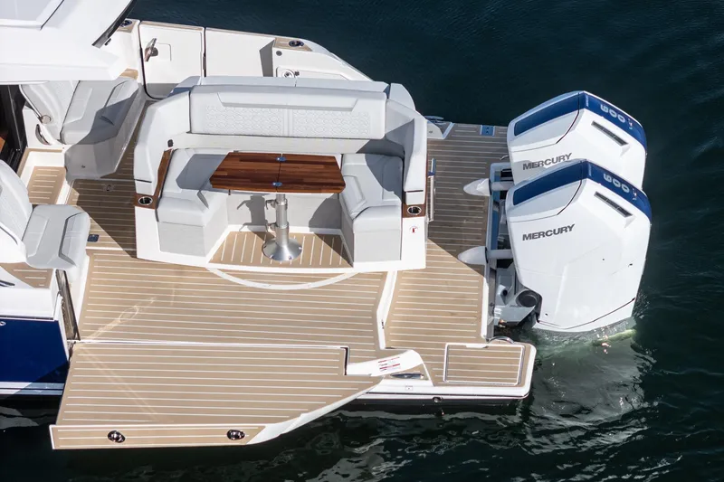 Slide: The Image of 2026 Tiara Yachts 43LE with dual Mercury engines and elegant seating on deck. - 19