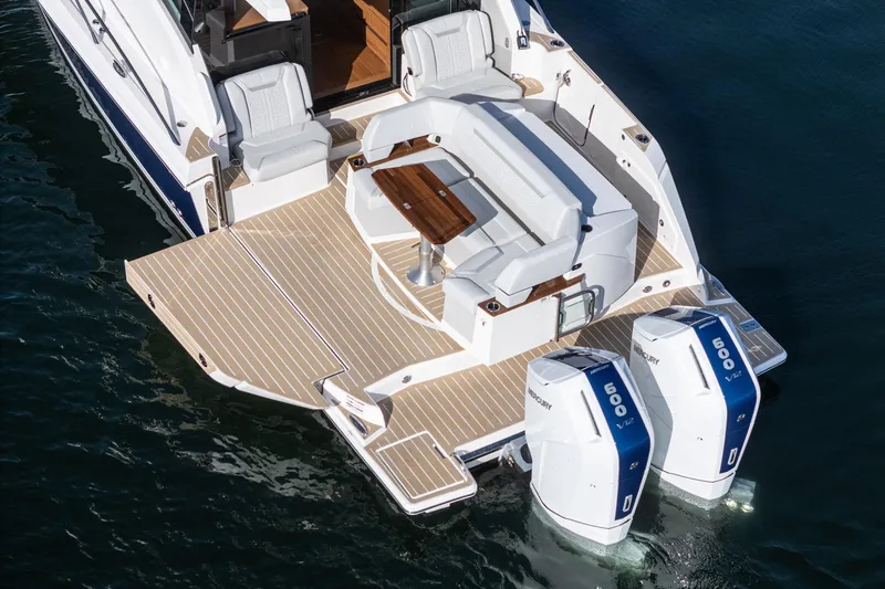 Slide: The Image of 2026 Tiara Yachts 43LE with twin Mercury 600 engines, featuring spacious deck seating. - 20