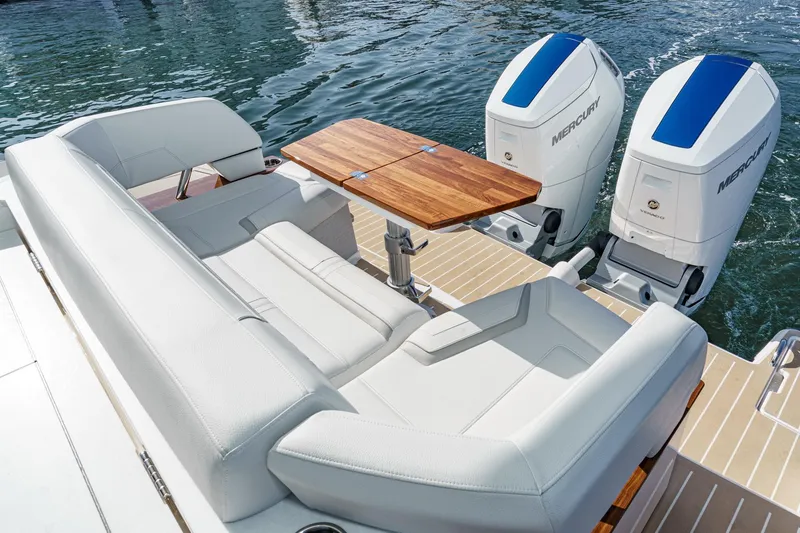 Slide: The Image of 2026 Tiara Yachts 43LE with luxurious seating and dual Mercury outboard engines. - 22