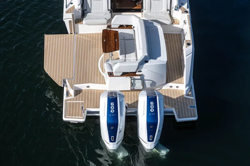 Slide: The Image of 2026 Tiara Yachts 43LE with dual Mercury 600 V12 engines, rear view on water. - 27