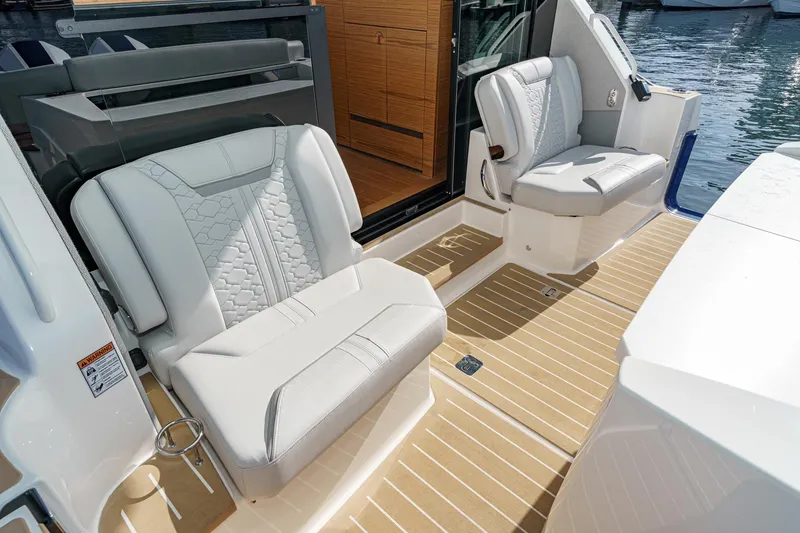 Slide: The Image of 2026 Tiara Yachts 43LE interior with luxurious seating and elegant design. - 30