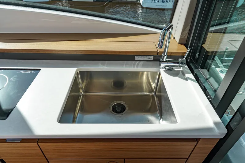 Slide: The Image of Modern kitchen sink in 2026 Tiara Yachts 43LE, featuring sleek design and stainless steel finish. - 36