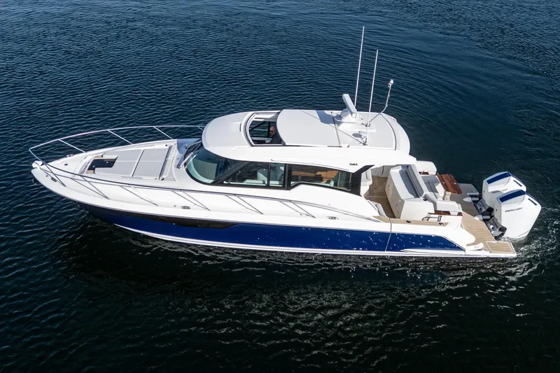 Slide: The Image of 2026 Tiara Yachts 43LE cruising on open water, showcasing sleek design and luxury features. - 4