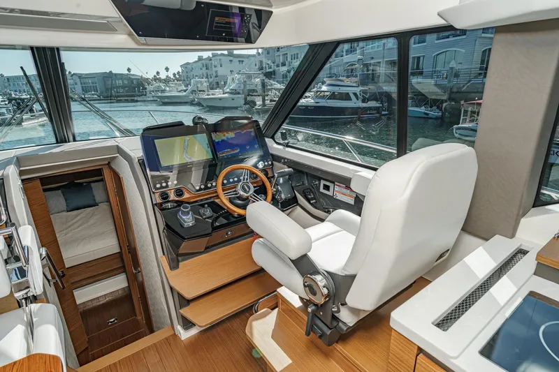 Slide: The Image of Interior of 2026 Tiara Yachts 43LE, featuring modern helm and luxurious cabin. - 45