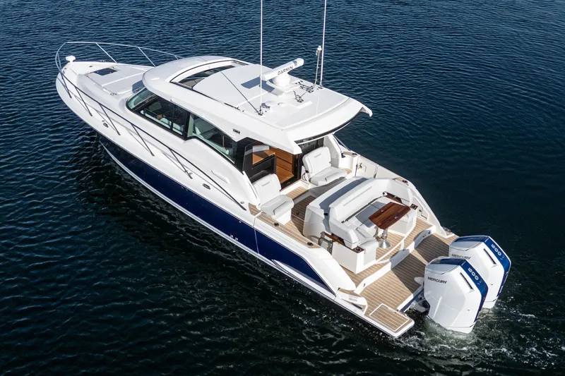 Slide: The Image of 2026 Tiara Yachts 43LE luxury boat cruising on open water. - 5