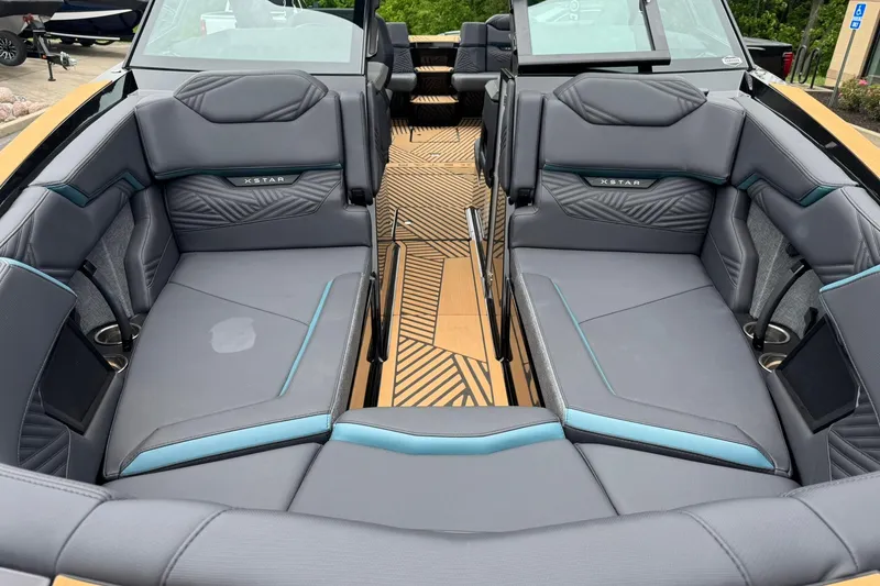 Slide: The Image of 2025 MasterCraft XStar 25 boat interior with luxurious seating and modern design. - 10