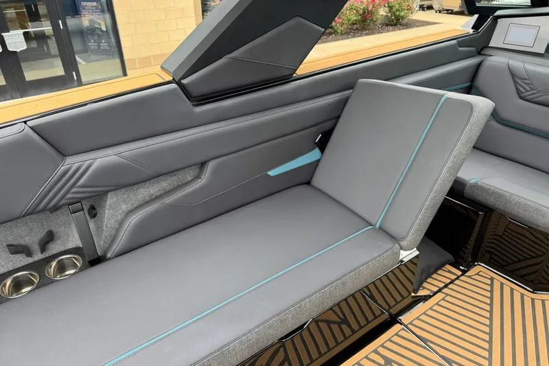 Slide: The Image of 2025 MasterCraft XStar 25 interior with sleek gray seating and modern design elements. - 15