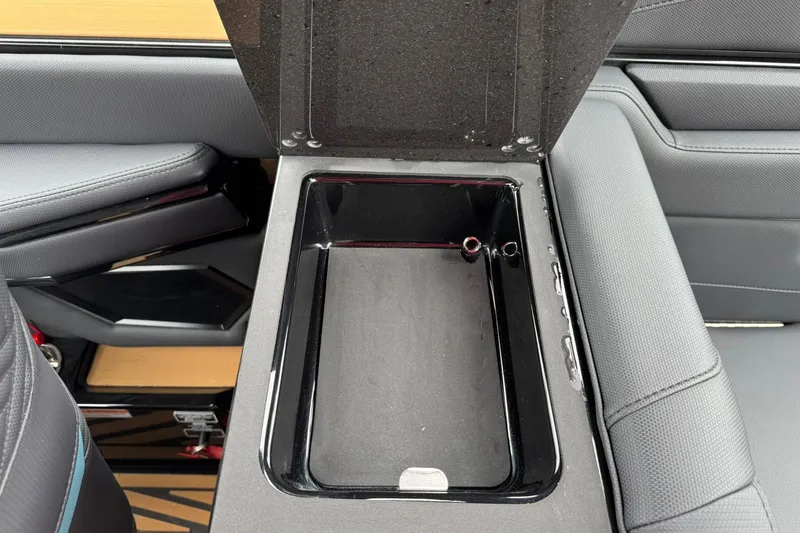 Slide: The Image of Interior storage compartment of 2025 MasterCraft XStar 25 boat, featuring sleek design and ample space. - 19