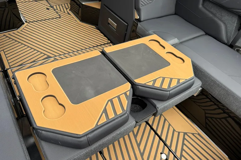 Slide: The Image of 2025 MasterCraft XStar 25 interior with stylish seating and integrated cup holders. - 20