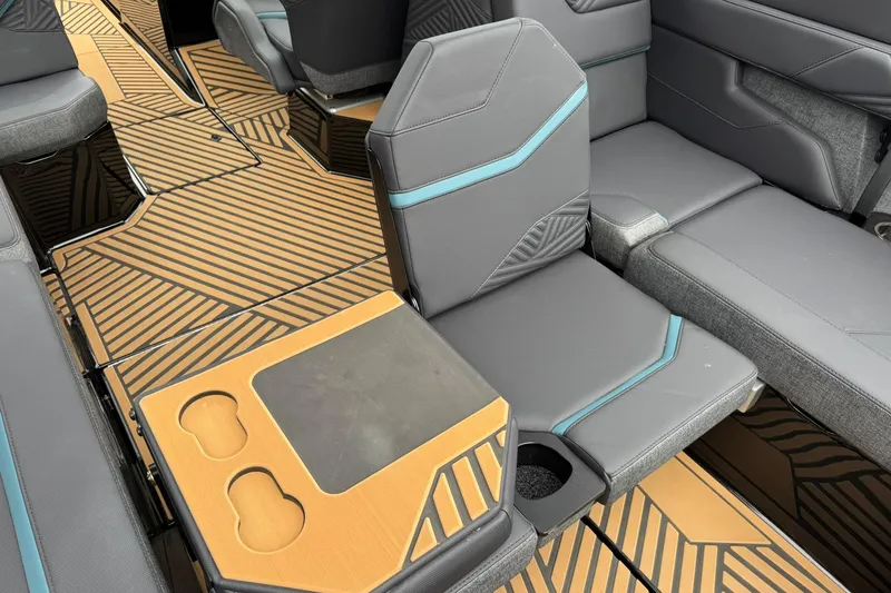 Slide: The Image of Interior of 2025 MasterCraft XStar 25 boat with stylish seating and modern design. - 22