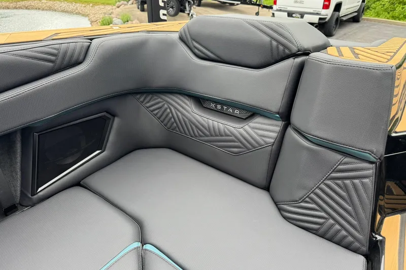 Slide: The Image of Luxurious interior of 2025 MasterCraft XStar 25 boat with stylish seating design. - 27