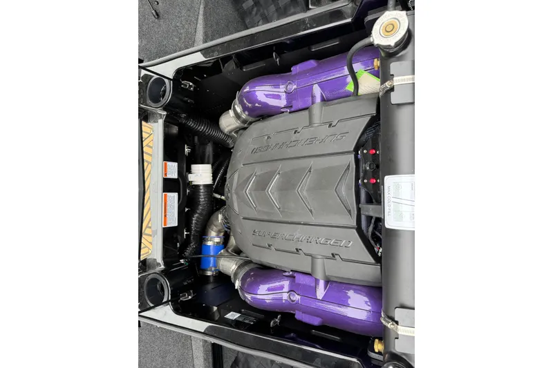 Slide: The Image of 2025 MasterCraft XStar 25 engine with supercharged components and purple accents. - 28