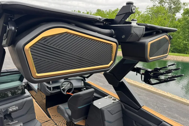 Slide: The Image of 2025 MasterCraft XStar 25 boat with premium audio speakers and sleek interior design. - 29
