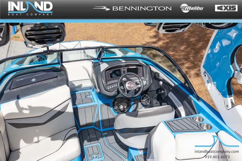 Slide: The Image of Interior view of a 2016 Centurion Ri237 boat, blue and white design. - 12