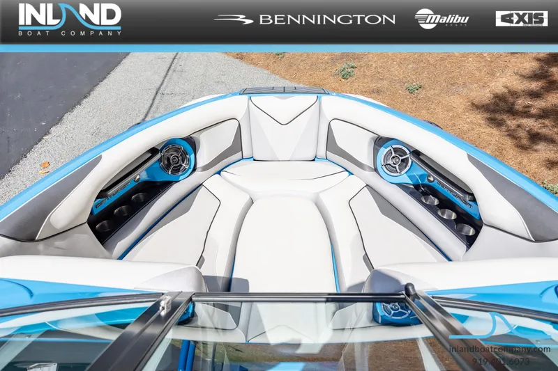 Slide: The Image of Interior view of a 2016 Centurion Ri237 boat with blue and white seating. - 19